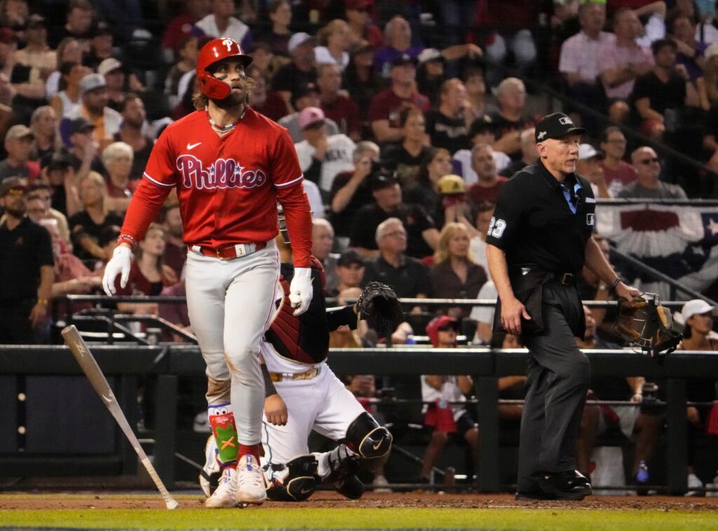 Philadelphia Phillies first baseman Bryce Harper (3) watches his solo home run against the Arizona Diamondbacks in the sixth inning in Game 5 of the NLCS of the 2023 MLB playoffs at Chase Field on Oct. 21, 2023, in Phoenix, AZ. The Phillies beat the Diamondbacks 6-1, giving Philadelphia the overall lead of 3-2 in the NLCS playoffs.