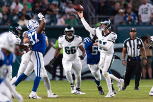 Aug 24, 2023; Philadelphia, Pennsylvania, USA; Philadelphia Eagles quarterback Tanner McKee (10) passes the ball past Indianapolis Colts defensive end Al-Quadin Muhammad (97) during the third quarter at Lincoln Financial Field.