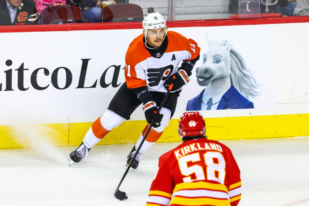 Oct 12, 2024; Calgary, Alberta, CAN; Philadelphia Flyers right wing Travis Konecny (11) controls the puck against the Calgary Flames during the first period at Scotiabank Saddledome.
