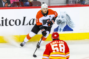 Oct 12, 2024; Calgary, Alberta, CAN; Philadelphia Flyers right wing Travis Konecny (11) controls the puck against the Calgary Flames during the first period at Scotiabank Saddledome.