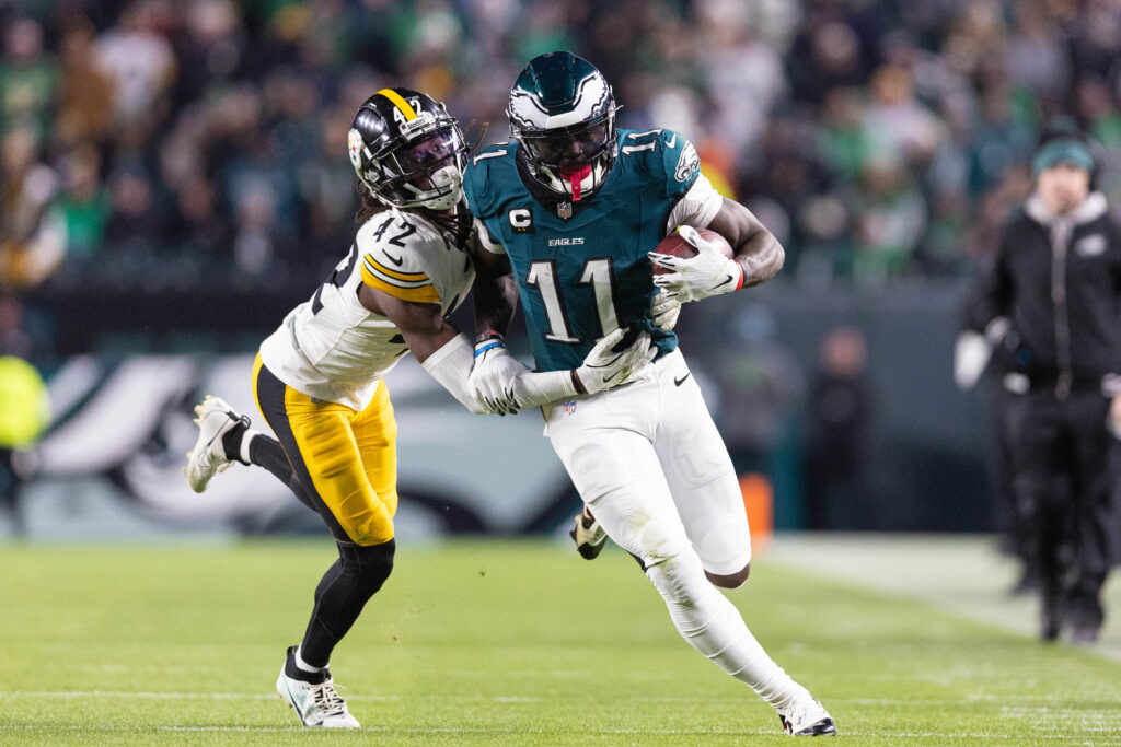 Dec 15, 2024; Philadelphia, Pennsylvania, USA; Philadelphia Eagles wide receiver A.J. Brown (11) runs with the ball against Pittsburgh Steelers cornerback James Pierre (42) at Lincoln Financial Field.