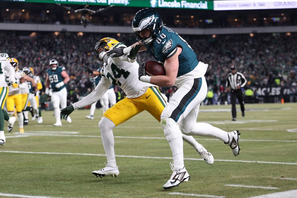 Jan 12, 2025; Philadelphia, Pennsylvania, USA; Philadelphia Eagles tight end Dallas Goedert (88) makes a catch against Green Bay Packers cornerback Carrington Valentine (24) during the third quarter in an NFC wild card game at Lincoln Financial Field.