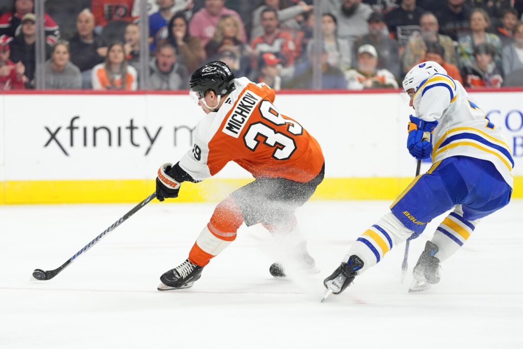Mar 29, 2025; Philadelphia, Pennsylvania, USA; Philadelphia Flyers right wing Matvei Michkov (39) shoots and scores a goal against the Buffalo Sabres in the second period at Wells Fargo Center.