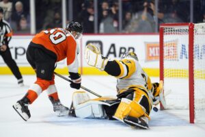 Oct 28, 2025; Philadelphia, Pennsylvania, USA; Philadelphia Flyers right wing Bobby Brink (10) scores a shootout goal against Pittsburgh Penguins goalie Arturs Silovs (37) in overtime at Xfinity Mobile Arena.