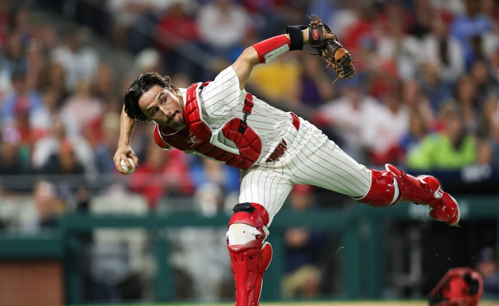 Sep 9, 2024; Philadelphia, Pennsylvania, USA; Philadelphia Phillies catcher Garrett Stubbs (21) fields a ball Tampa Bay Rays at Citizens Bank Park.