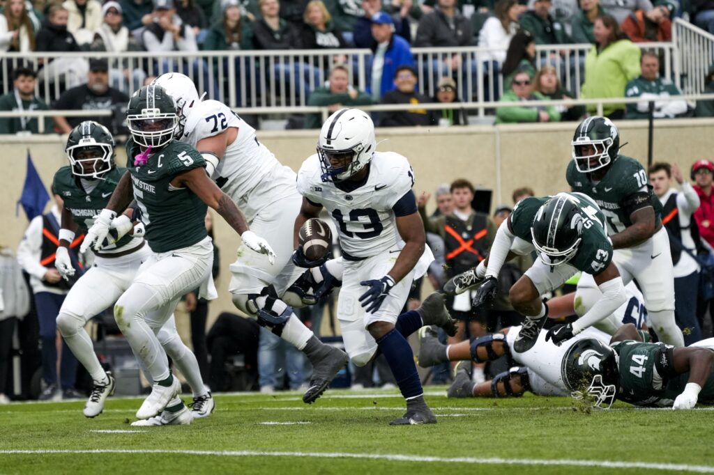 Nov 15, 2025; East Lansing, Michigan, USA; Penn State Nittany Lions running back Kaytron Allen (13) runs for a touchdown in the first quarter against the Michigan State Spartans at Spartan Stadium.