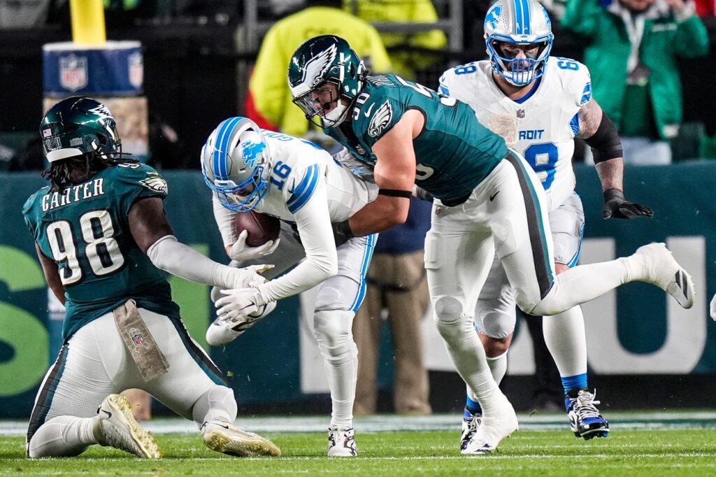 Detroit Lions quarterback Jared Goff (16) is sacked by Philadelphia Eagles linebacker Jaelan Phillips (50) during the first half at Lincoln Financial Field in Philadelphia on Sunday, November 16, 2025.