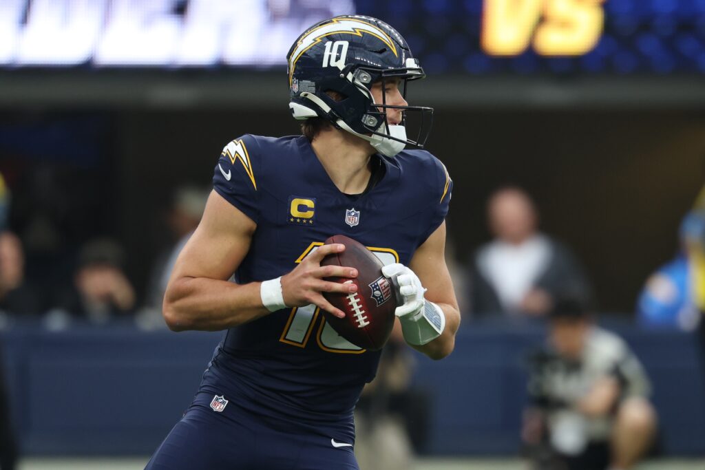 Nov 30, 2025; Inglewood, California, USA; Los Angeles Chargers quarterback Justin Herbert (10) drops back to pass against the Las Vegas Raiders during the second half at SoFi Stadium.