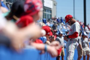 Mar 2, 2025; Dunedin, Florida, USA; Philadelphia Phillies outfielder Justin Crawford (80) signs autographs for fans before a game against the Toronto Blue Jays during spring training at TD Ballpark.
