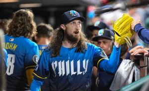 Aug 22, 2025; Philadelphia, Pennsylvania, USA; Philadelphia Phillies pitcher Matt Strahm (25) is greeted by teammates in the dugout after the seventh inning against the Washington Nationals at Citizens Bank Park.
