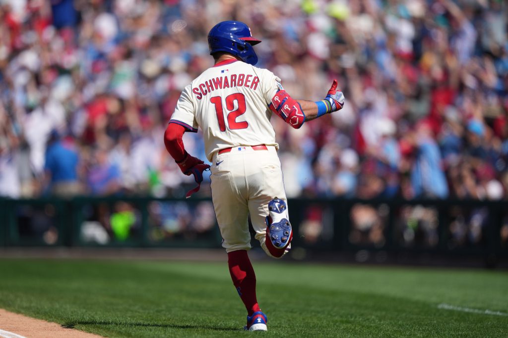 Sep 14, 2025; Philadelphia, Pennsylvania, USA; Philadelphia Phillies designated hitter Kyle Schwarber (12) reacts after hitting a home run against the Kansas City Royals in the first inning at Citizens Bank Park.