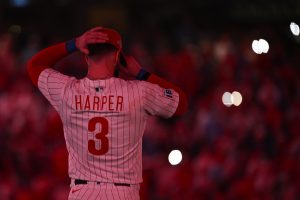 Oct 6, 2025; Philadelphia, Pennsylvania, USA; Philadelphia Phillies first baseman Bryce Harper (3) looks on at the start of the ninth inning during game two of the NLDS round against the Los Angeles Dodgers for the 2025 MLB playoffs at Citizens Bank Park.
