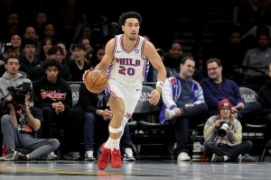 Nov 28, 2025; Brooklyn, New York, USA; Philadelphia 76ers guard Jared McCain (20) brings the ball up court against the Brooklyn Nets during the first quarter at Barclays Center.