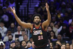 Dec 7, 2025; Philadelphia, Pennsylvania, USA; Philadelphia 76ers center Joel Embiid (21) reacts after scoring against the Los Angeles Lakers during the fourth quarter at Xfinity Mobile Arena.