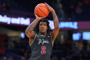 Dec 11, 2025; Syracuse, New York, USA; Saint Joseph's Hawks guard Deuce Jones (2) shoots against the Syracuse Orange during the first half at the JMA Wireless Dome.