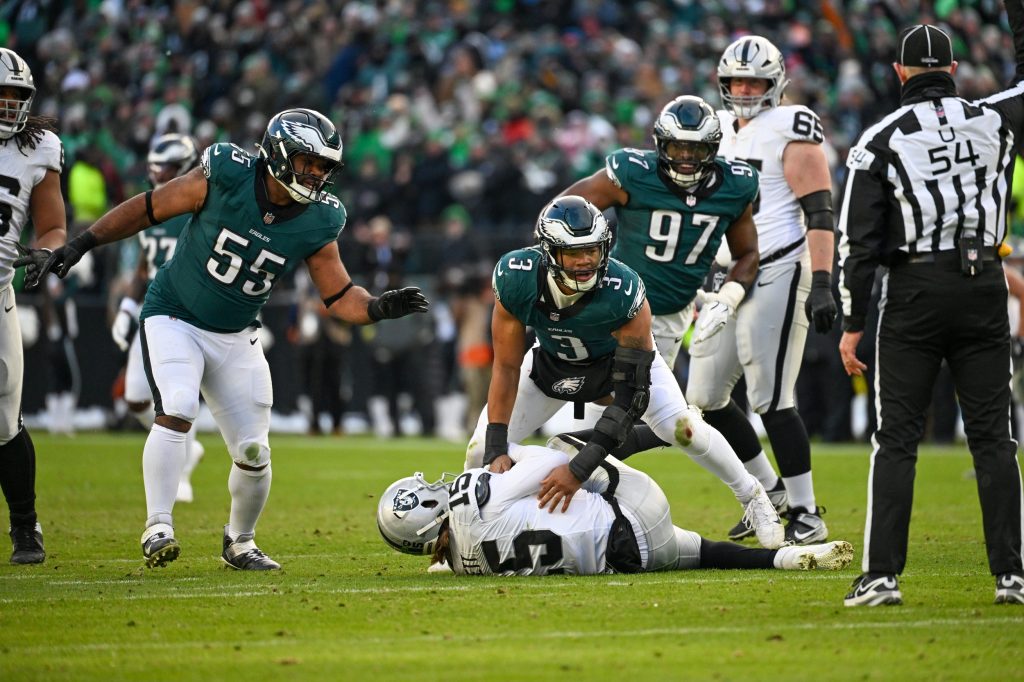 Dec 14, 2025; Philadelphia, Pennsylvania, USA; Las Vegas Raiders quarterback Kenny Pickett (15) is sacked by Philadelphia Eagles linebacker Nolan Smith Jr. (3) during the third quarter at Lincoln Financial Field.