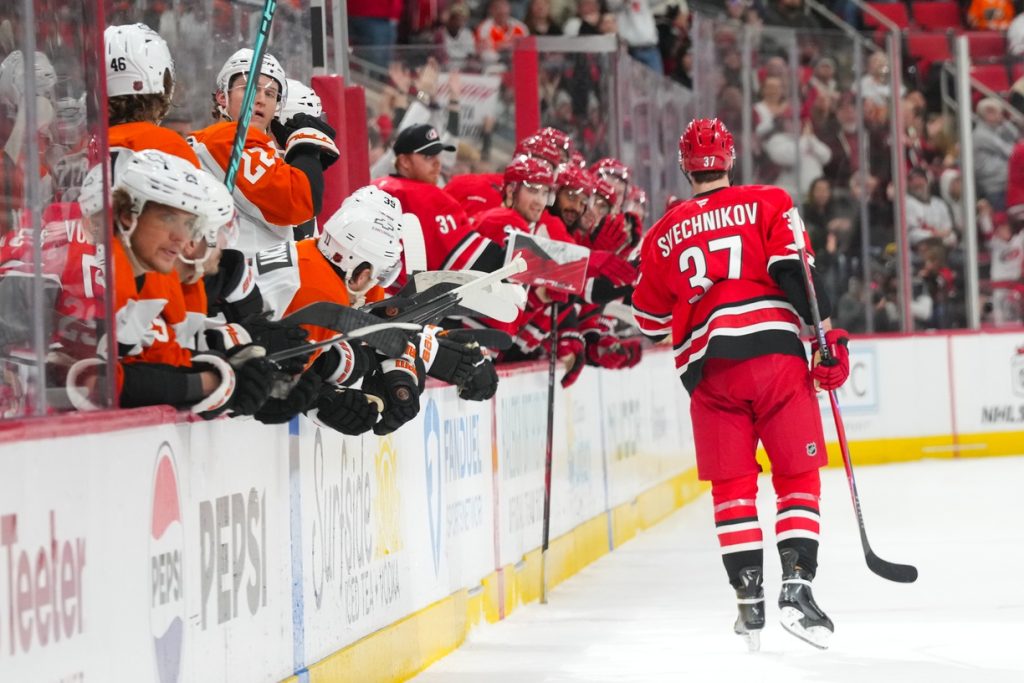 Dec 14, 2025; Raleigh, North Carolina, USA; Carolina Hurricanes right wing Andrei Svechnikov (37) celebrates after scoring the game winner in the shootout against the Philadelphia Flyers at Lenovo Center.