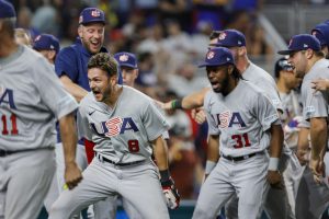 Mar 18, 2023; Miami, Florida, USA; USA shortstop Trea Turner (8) celebrates with teammates after hitting a grand slam during the eighth inning against Venezuela at LoanDepot Park.