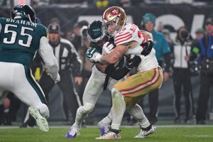 Dec 3, 2023; Philadelphia, Pennsylvania, USA; San Francisco 49ers running back Christian McCaffrey (23) is tackled by Philadelphia Eagles safety Sydney Brown (21) during the second quarter at Lincoln Financial Field.