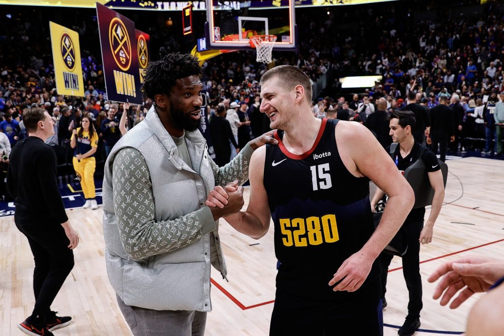 Jan 27, 2024; Denver, Colorado, USA; Philadelphia 76ers center Joel Embiid (21) and Denver Nuggets center Nikola Jokic (15) after the game at Ball Arena.