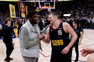 Jan 27, 2024; Denver, Colorado, USA; Philadelphia 76ers center Joel Embiid (21) and Denver Nuggets center Nikola Jokic (15) after the game at Ball Arena.