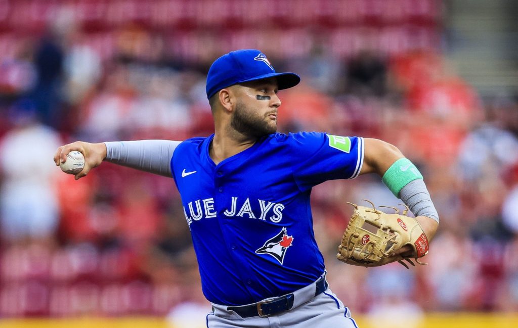 Sep 2, 2025; Cincinnati, Ohio, USA; Toronto Blue Jays shortstop Bo Bichette (11) throws to first to get Cincinnati Reds third baseman Ke'Bryan Hayes (not pictured) out in the second inning at Great American Ball Park.