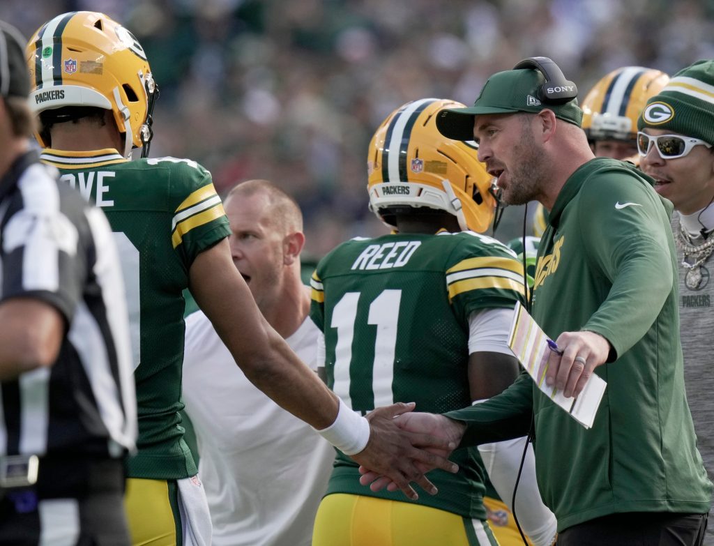 Green Bay Packers quarterback coach Sean Mannion is shown congratulating quarterback Jordan Love (10) during the second quarter of their game Sunday, September 7, 2025 at Lambeau Field in Green Bay, Wisconsin. The Green Bay Packers beat the Detroit Lions 27-13.Green Bay Packers quarterback coach Sean Mannion is shown congratulating quarterback Jordan Love (10) during the second quarter of their game Sunday, September 7, 2025 at Lambeau Field in Green Bay, Wisconsin. The Green Bay Packers beat the Detroit Lions 27-13.