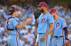 Oct 9, 2025; Los Angeles, California, USA; Philadelphia Phillies catcher J.T. Realmuto (10) talks to pitcher Cristopher Sanchez (61) in the sixth inning against the Los Angeles Dodgers during game four of the NLDS round for the 2025 MLB playoffs at Dodger Stadium.