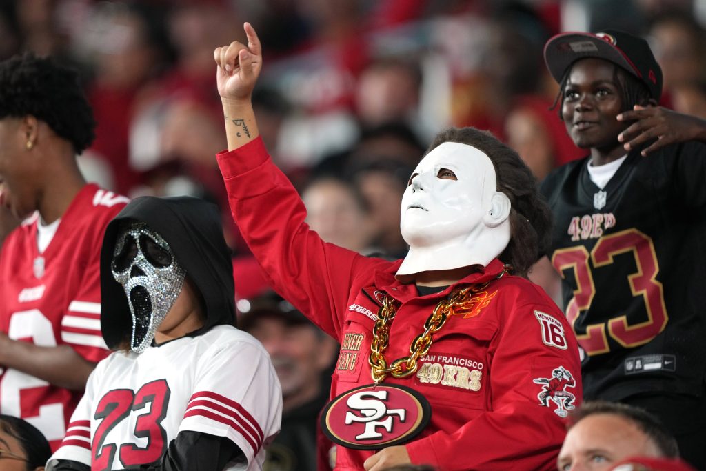 Oct 19, 2025; Santa Clara, California, USA; A San Francisco 49ers fan wears a mask in the stands during the fourth quarter against the Atlanta Falcons at Levi's Stadium.