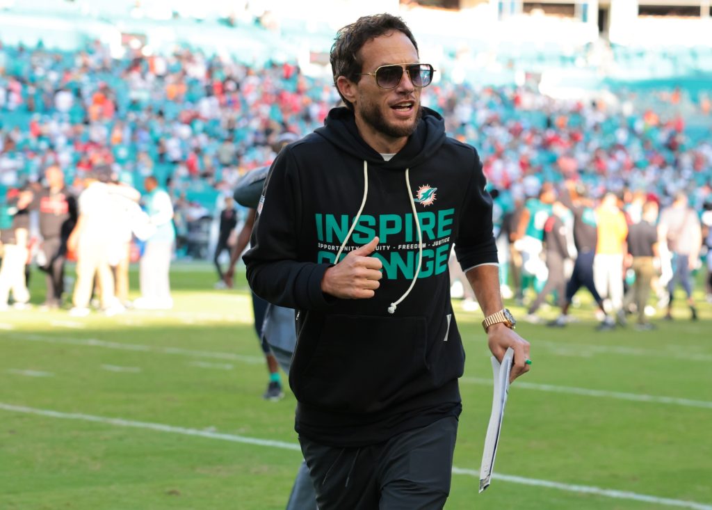 Dec 28, 2025; Miami Gardens, Florida, USA; Miami Dolphins head coach Mike McDaniel runs off the field following a win over the Tampa Bay Buccaneers at Hard Rock Stadium.