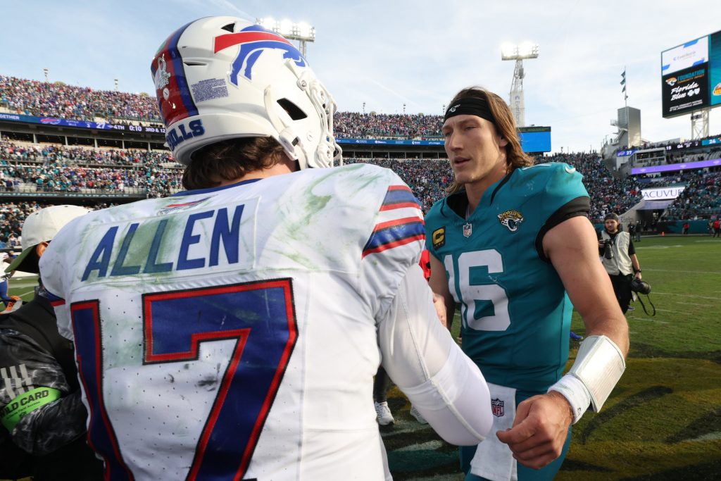 Jan 11, 2026; Jacksonville, FL, USA; Buffalo Bills quarterback Josh Allen (17) and Jacksonville Jaguars quarterback Trevor Lawrence (16) after an AFC Wild Card Round game at EverBank Stadium.