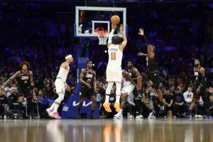 Jan 24, 2026; Philadelphia, Pennsylvania, USA; New York Knicks guard Jalen Brunson (11) scores a three pointer against the Philadelphia 76ers during the third quarter at Xfinity Mobile Arena.