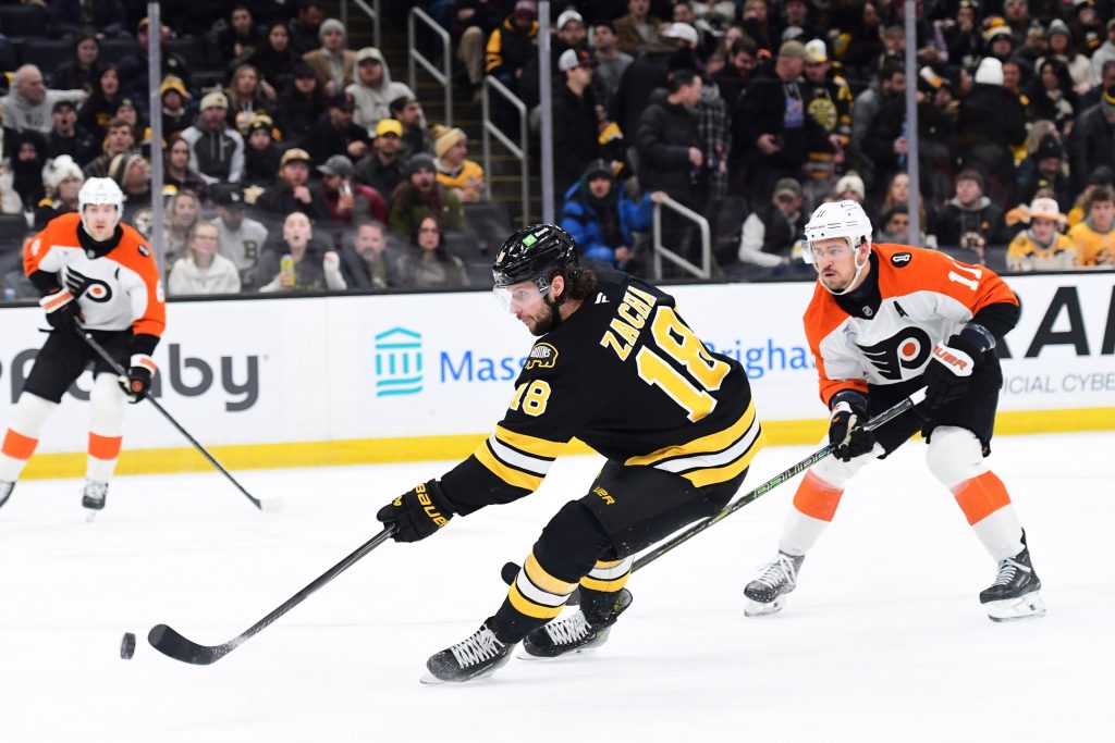 Jan 29, 2026; Boston, Massachusetts, USA; Boston Bruins center Pavel Zacha (18) scores a goal while Philadelphia Flyers right wing Travis Konecny (11) looks on during the first period at TD Garden.