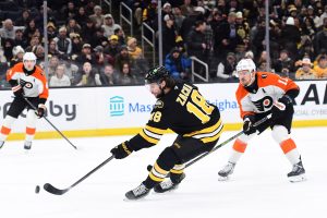 Jan 29, 2026; Boston, Massachusetts, USA; Boston Bruins center Pavel Zacha (18) scores a goal while Philadelphia Flyers right wing Travis Konecny (11) looks on during the first period at TD Garden.