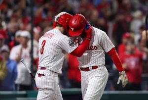 Nov 1, 2022; Philadelphia, PA, USA; Philadelphia Phillies first baseman Rhys Hoskins (17) celebrates with designated hitter Bryce Harper (3) after hitting a solo home run against the Houston Astros during the fifth inning in game three of the 2022 World Series at Citizens Bank Park.