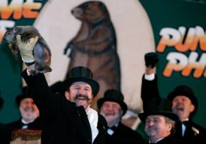 Groundhog handler Ben Hughes holds up Punxsutawney Phil. Phil did not see his shadow predicting an early spring during festivities Feb. 2, 2007.