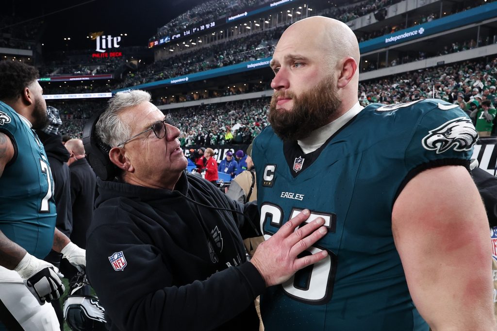 Jan 26, 2025; Philadelphia, PA, USA; Philadelphia Eagles assistant coach Jeff Stoutland (L) and offensive tackle Lane Johnson (65) in the final minute of a victory in the NFC Championship game against the Washington Commanders at Lincoln Financial Field.