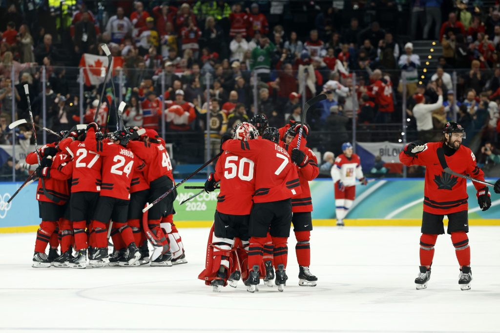 Feb 18, 2026; Milan, Italy; Canada celebrates their win against Czechia in a men's ice hockey quarterfinal during the Milano Cortina 2026 Olympic Winter Games at Milano Santagiulia Ice Hockey Arena.