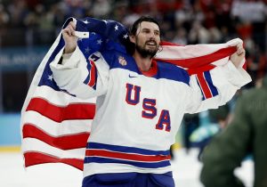 Feb 22, 2026; Milan, Italy; Connor Hellebuyck (37) of the United States celebrates after defeating Canada in the men's ice hockey gold medal game during the Milano Cortina 2026 Olympic Winter Games at Milano Santagiulia Ice Hockey Arena.