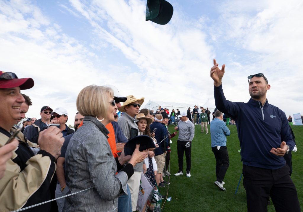 Former Coyote Paul Bissonnette tosses hats to fans on the 10th tee box during the Waste Management Phoenix Open Annexus Pro-Am at TPC Scottsdale Stadium Course. Bissonnette was Doan's caddie. Annexus Pro Am