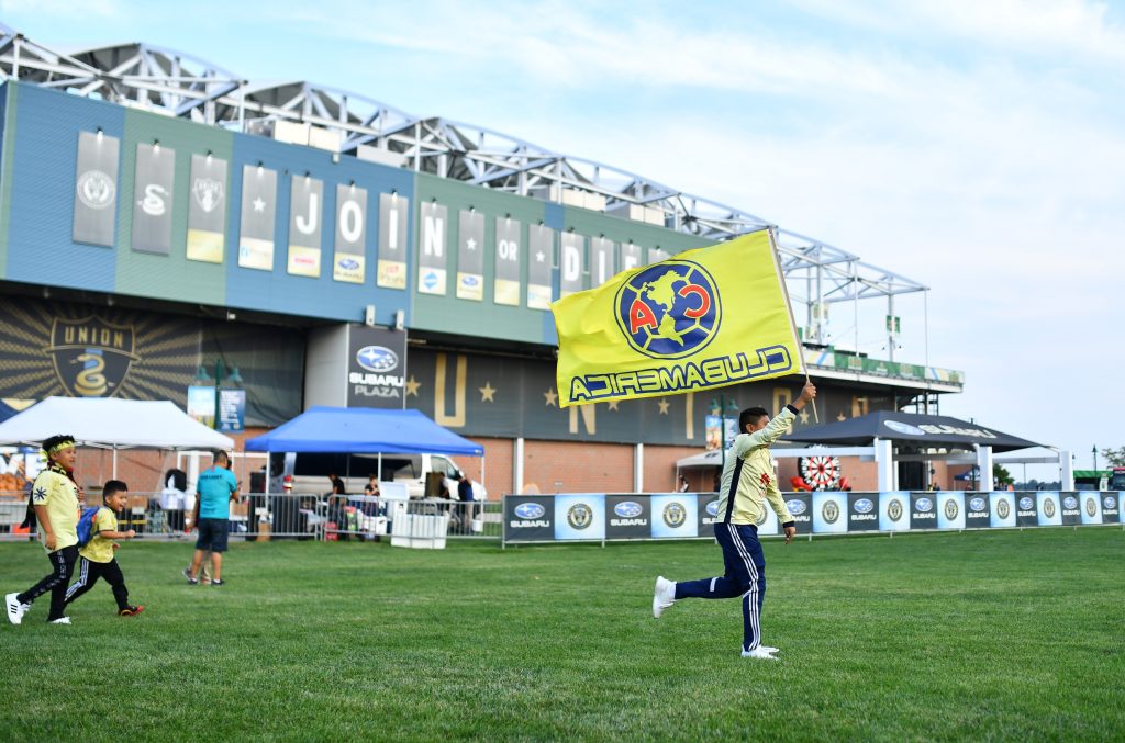 Sep 15, 2021; Philadelphia, PA, USA; A Club America fan waves a flag outside of Subaru Park before a match between Club America and the Philadelphia Union at Subaru Park.