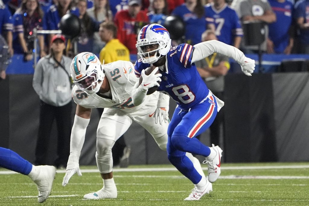Sep 18, 2025; Orchard Park, New York, USA; Buffalo Bills wide receiver Elijah Moore (18) runs against Miami Dolphins linebacker Jaelan Phillips (15) in the fourth quarter at Highmark Stadium.