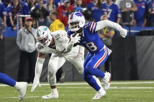 Sep 18, 2025; Orchard Park, New York, USA; Buffalo Bills wide receiver Elijah Moore (18) runs against Miami Dolphins linebacker Jaelan Phillips (15) in the fourth quarter at Highmark Stadium.