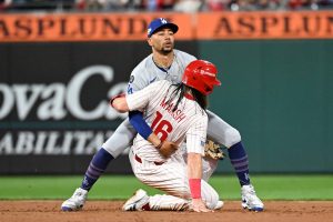 Oct 6, 2025; Philadelphia, Pennsylvania, USA; Los Angeles Dodgers shortstop Mookie Betts (50) catches Philadelphia Phillies center fielder Brandon Marsh (16) stealing second base in the third inning during game two of the NLDS round for the 2025 MLB playoffs at Citizens Bank Park.
