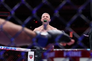 Nov 15, 2025; New York, NY, UNITED STATES; Kyle Daukaus (red gloves) reacts after defeating Gerald Meerschaert (blue gloves) in the middleweight bout during UFC 322 at Madison Square Garden.