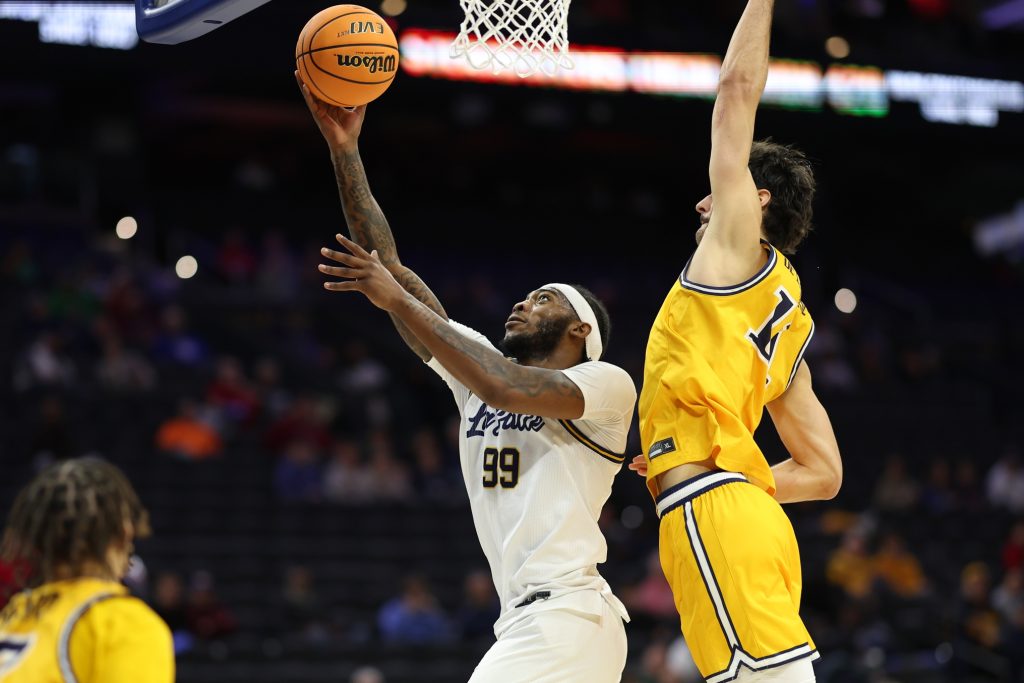Dec 6, 2025; Philadelphia, PA, USA; La Salle Explorers guard Rob Dockery (99) drives for a shot against the Drexel Dragons during the second half at Xfinity Mobile Arena.