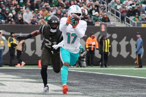 Dec 7, 2025; East Rutherford, New Jersey, USA; Miami Dolphins wide receiver Jaylen Waddle (17) makes a catch for a touchdown against the New York Jets during the first half at MetLife Stadium.