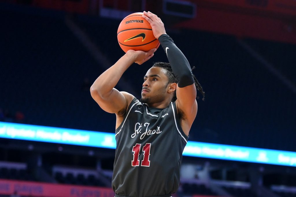 Dec 11, 2025; Syracuse, New York, USA; Saint Joseph's Hawks guard Jaiden Glover-Toscano (11) shoots against the Syracuse Orange during the first half at the JMA Wireless Dome.