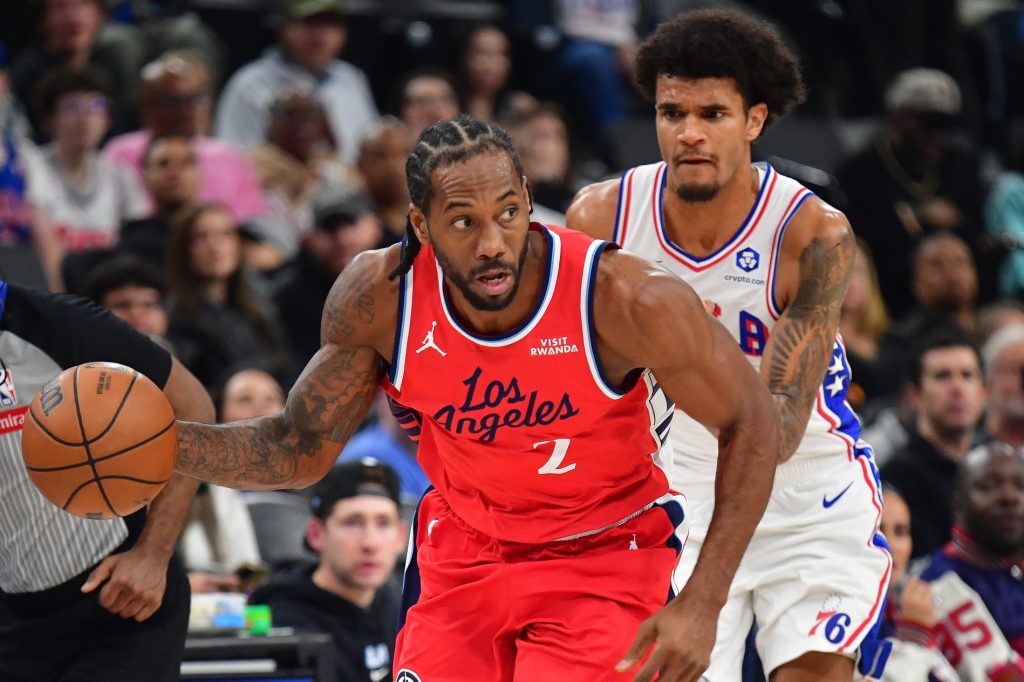 Feb 2, 2026; Inglewood, California, USA; Los Angeles Clippers forward Kawhi Leonard (2) moves the ball ahead of Philadelphia 76ers forward Dominick Barlow (25) during the first half at Intuit Dome.