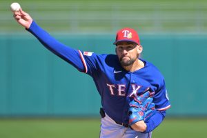 Feb 20, 2026; Surprise, Arizona, USA; Texas Rangers pitcher Nathan Eovaldi (17) delivers to the plate in the first inning against the Kansas City Royals at Surprise Stadium.